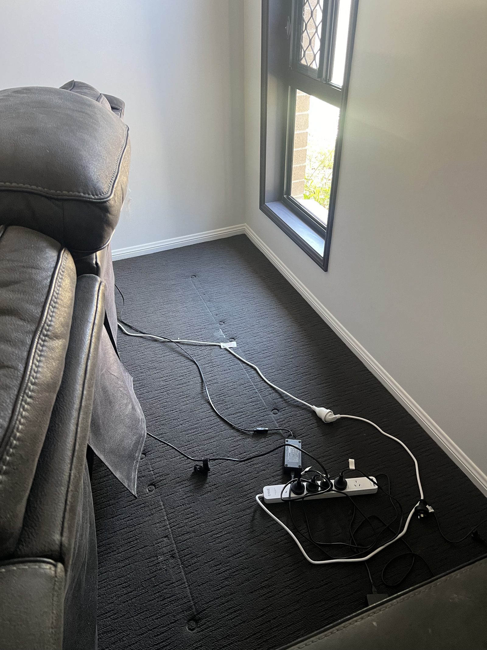 A lounge room carpet vacuumed clean after a Care for a Clean visit