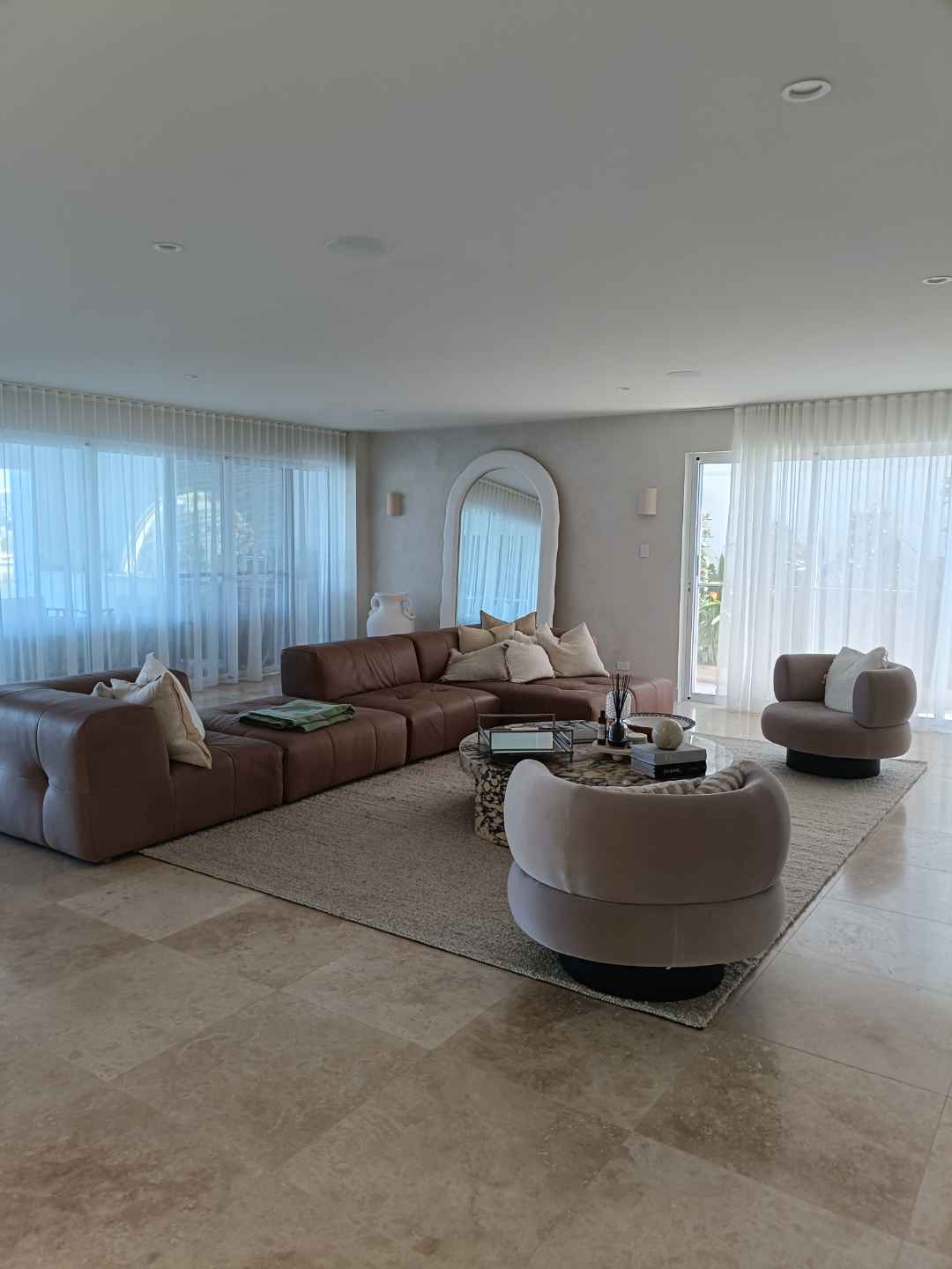 A large open living room kept immaculate as part of ongoing home management